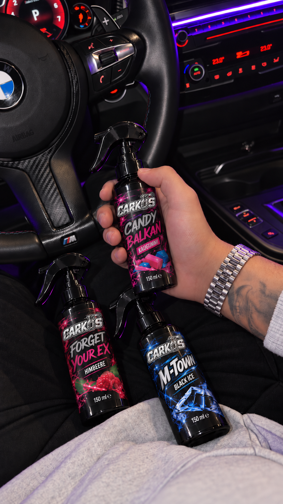 CARKOS-Duftsprays im BMW-Cockpit